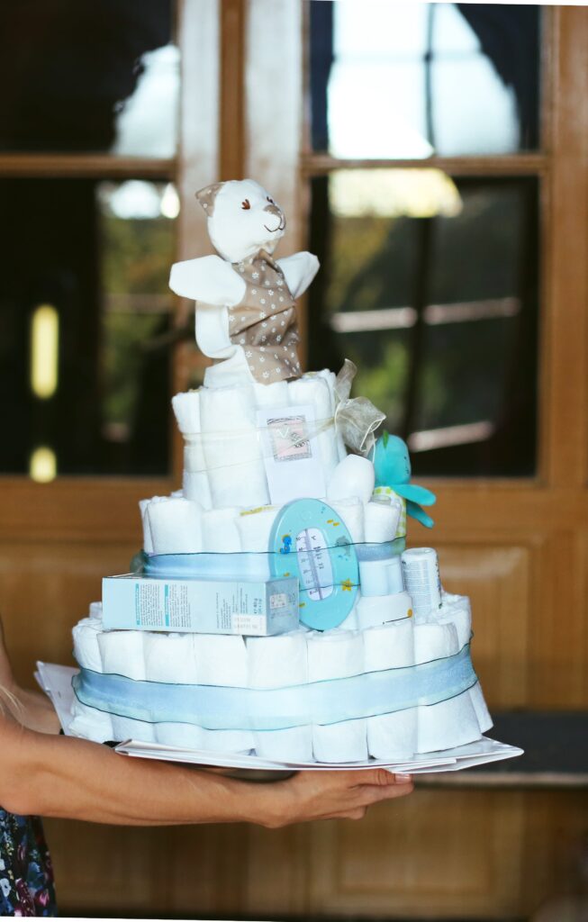 Diaper raffle for a baby shower. This adorable diaper cake is an adorable idea for expectant moms