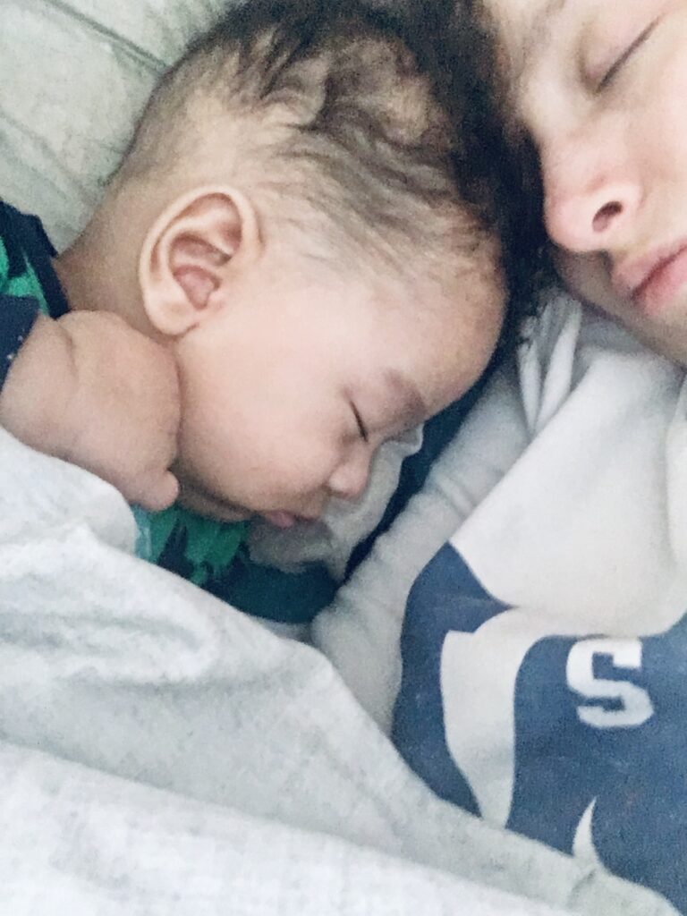 Adorable baby co sleeping with mom