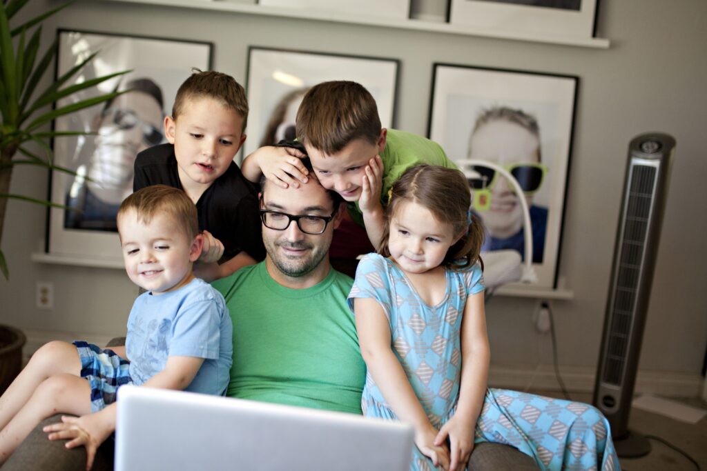 Work from home dad with his four children - men who are willing to learn tend to make great dads