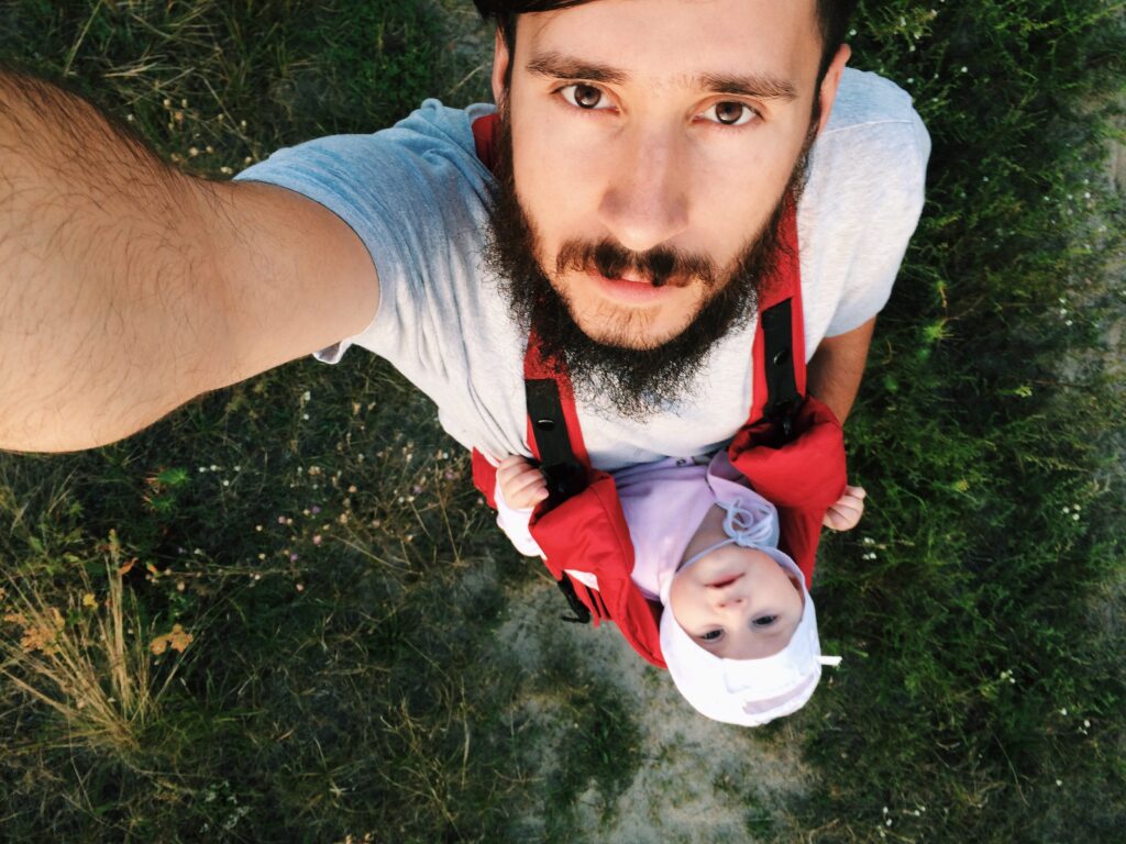 Goofy Men make the best dads! Father taking a selfie with his son