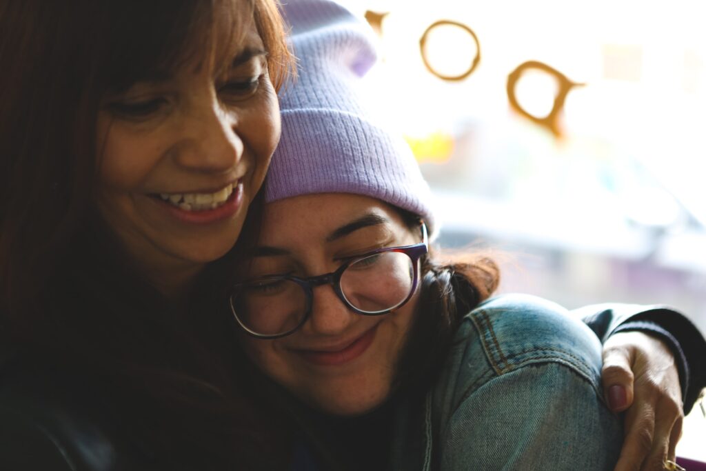 Teach Her How To Live A Complete Life - Loving moment between mother and daughter after a breakup