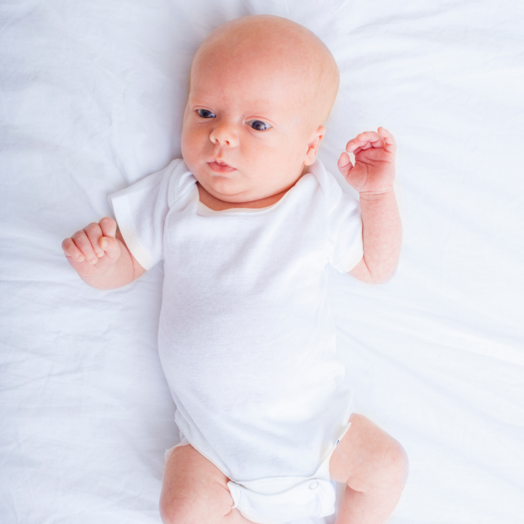 Adorable newborn baby with quivering lower lip