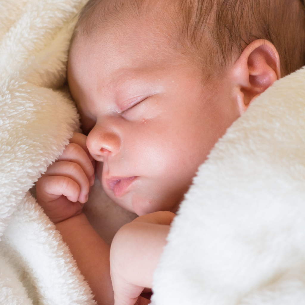 Gorgeous newborn baby sleeping in