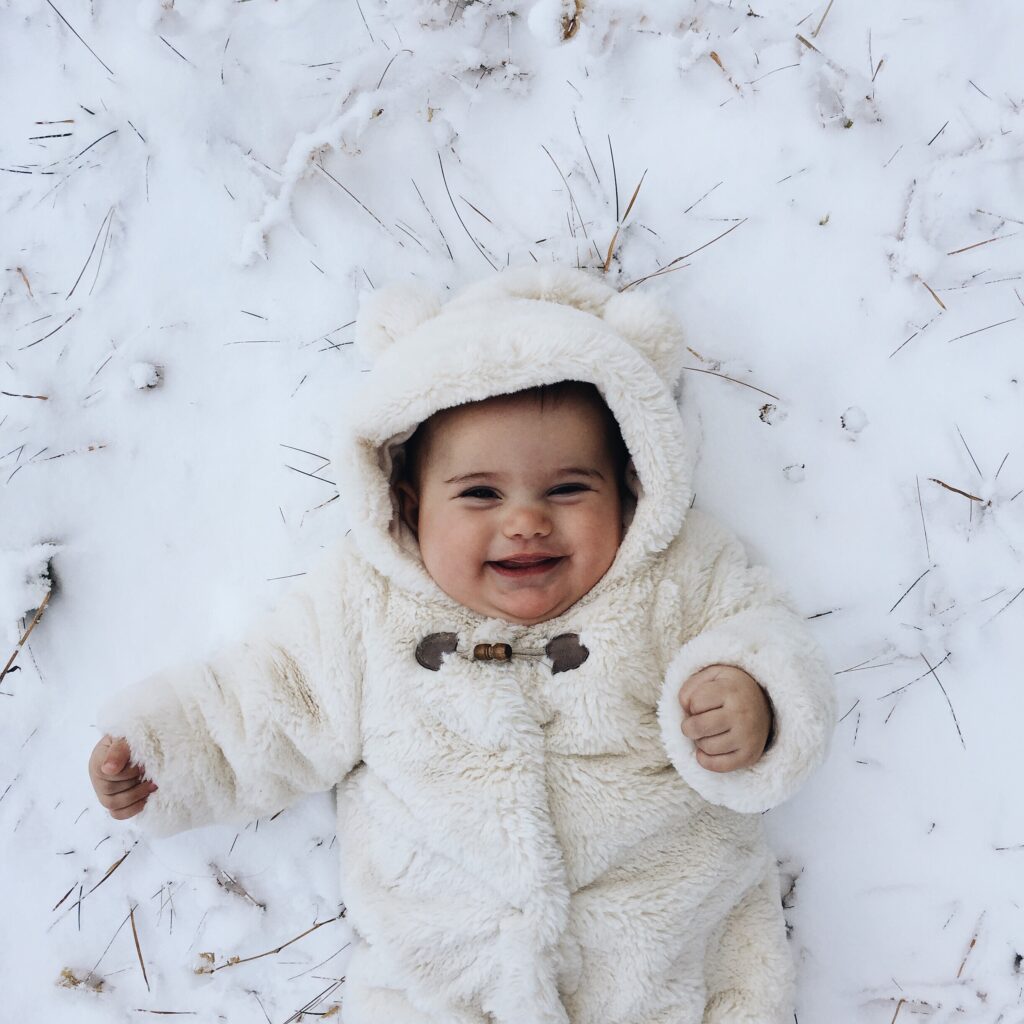 Baby girl playing in snow - Classic Two Syllable Girl Names