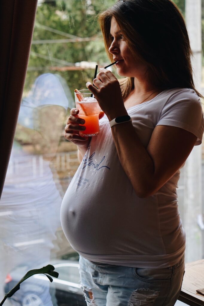 Pregnant woman drinking