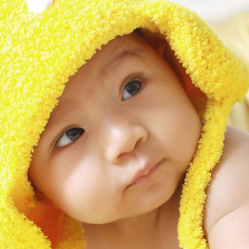 Baby boy with yellow hat