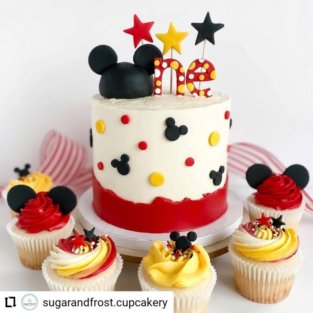 Mickey mouse-inspired birthday cake and cupcakes