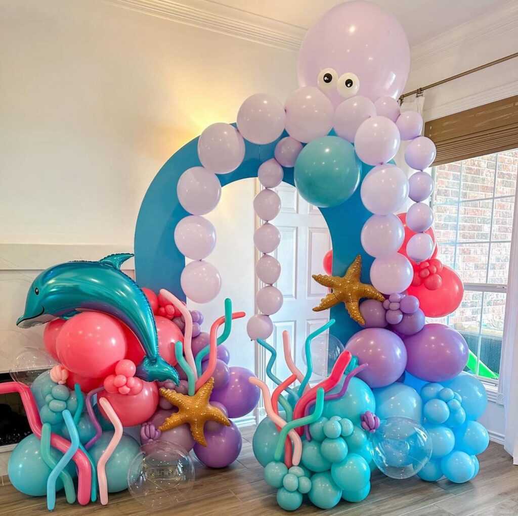 Under the sea first birthday theme and balloon decorations