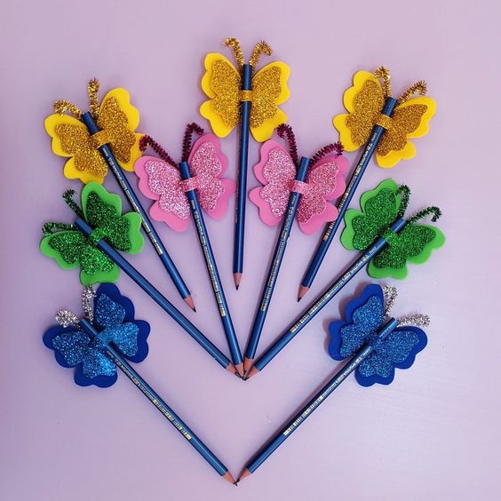 DIY paper butterfly pencil toppers with glitters and in different vibrant colors