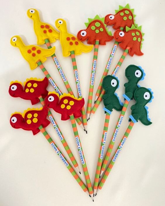 DIY felt dinosaur pencil toppers in different kinds and colors