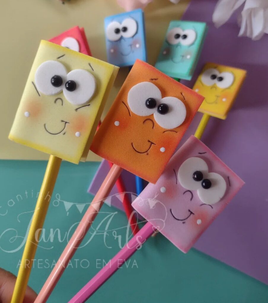 DIY smiley mini book pencil toppers in different pastel colors