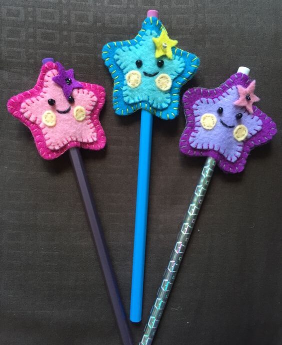 DIY felt shooting stars pencil toppers in different colors